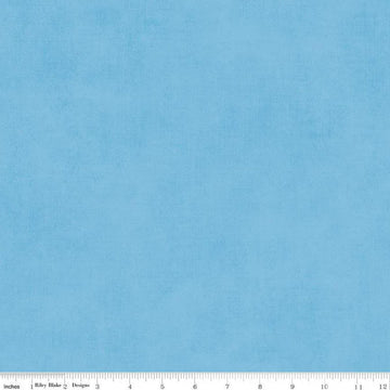 Image of the Shades Celestial quilting cotton fabric by Riley Blake Designs. Features a light blue fabric with a mottled semisold background. 
Cute Little Fabric Shop