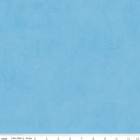 Image of the Shades Celestial quilting cotton fabric by Riley Blake Designs. Features a light blue fabric with a mottled semisold background. 
Cute Little Fabric Shop