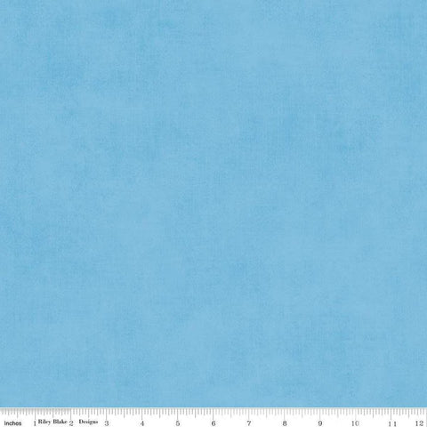 Image of the Shades Celestial quilting cotton fabric by Riley Blake Designs. Features a light blue fabric with a mottled semisold background. 
Cute Little Fabric Shop