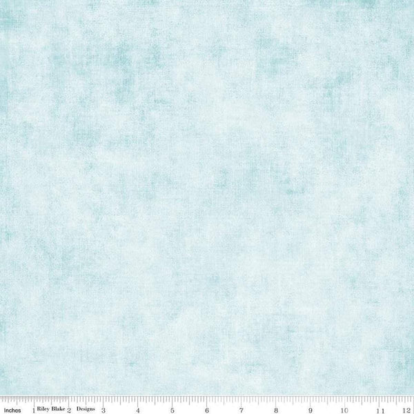 Image of the Shades Bleached Denim quilting cotton fabric by Riley Blake Designs. Features a light blue fabric with a mottled semisold background. 
Cute Little Fabric Shop