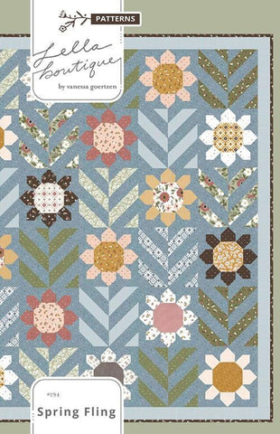 Image of the Spring Fling quilt pattern by Lella Boutique for Moda Fabrics. Features flowers and leaves on a blue background. 
Cute Little Fabric Shop