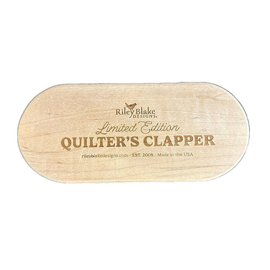 Image of the Limited Edition 7" Quilter's Clapper by Riley Blake Designs. Features a wooden 7" quilt clapper with "Limited Edition Quilt Clapper." 
Cute Little Fabric Shop