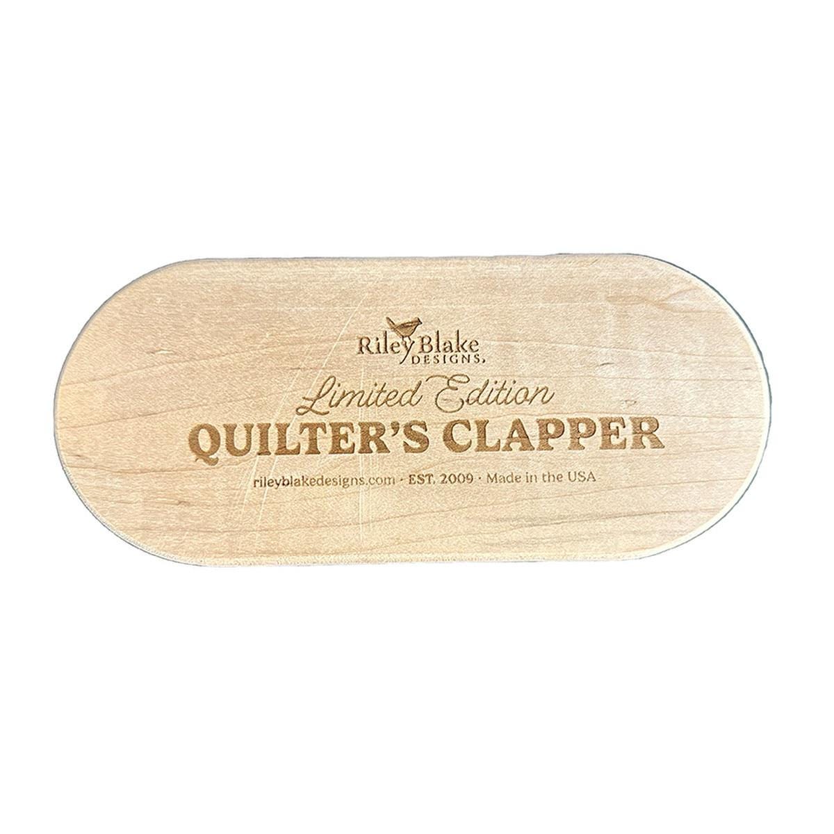 Image of the Limited Edition 7" Quilter's Clapper by Riley Blake Designs. Features a wooden 7" quilt clapper with "Limited Edition Quilt Clapper." 
Cute Little Fabric Shop