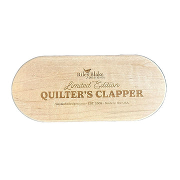 Image of the Limited Edition 7" Quilter's Clapper by Riley Blake Designs. Features a wooden 7" quilt clapper with "Limited Edition Quilt Clapper." 
Cute Little Fabric Shop
