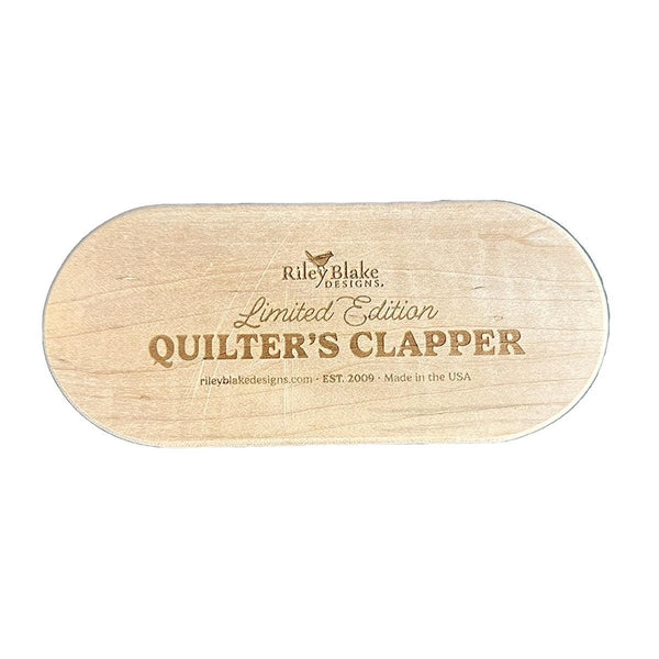 Image of the Limited Edition 7&quot; Quilter&#39;s Clapper by Riley Blake Designs. Features a wooden 7&quot; quilt clapper with &quot;Limited Edition Quilt Clapper.&quot; 
Cute Little Fabric Shop