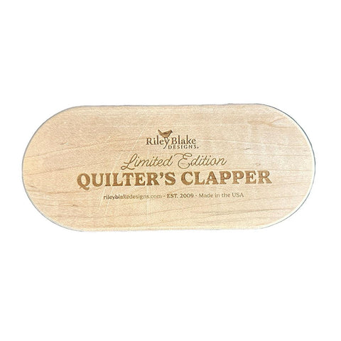 Image of the Limited Edition 7&quot; Quilter&#39;s Clapper by Riley Blake Designs. Features a wooden 7&quot; quilt clapper with &quot;Limited Edition Quilt Clapper.&quot; 
Cute Little Fabric Shop