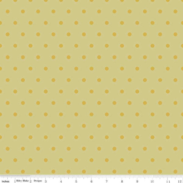 Image of the Wanderlust Sunshine Flax quilting cotton fabric by Danelys Sidron for Riley Blake Designs. Features an array of small suns on a yellow green background. 
Cute Little Fabric Shop