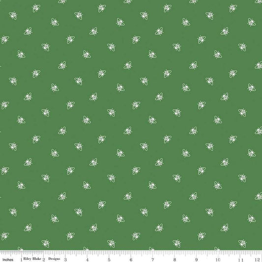 Image of the Perennial Bees Clover quilting cotton fabric by Jill Finley for Riley Blake Designs. Features small bees scattered on a green background. 
Cute Little Fabric Shop