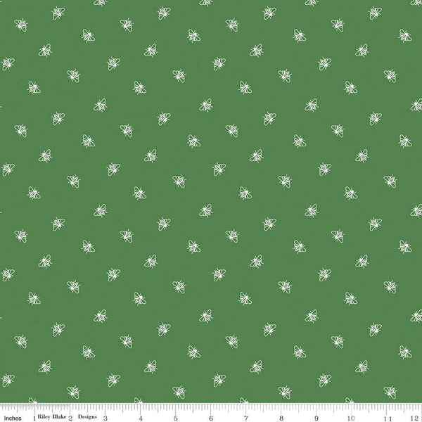 Image of the Perennial Bees Clover quilting cotton fabric by Jill Finley for Riley Blake Designs. Features small bees scattered on a green background. 
Cute Little Fabric Shop