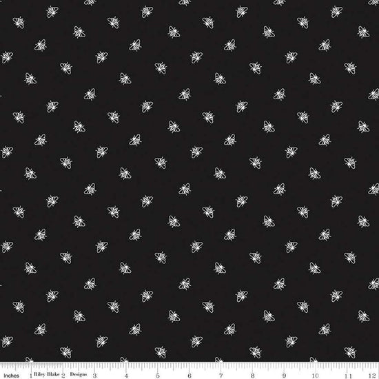 Image of the Perennial Bees Black quilting cotton fabric by Jill Finley for Riley Blake Designs. Features small bees scattered on a black background. 
Cute Little Fabric Shop