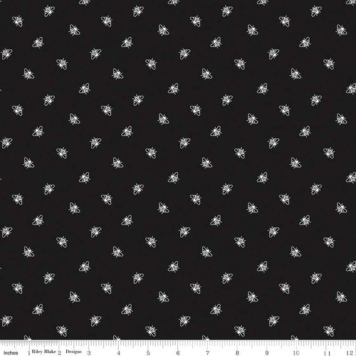 Image of the Perennial Bees Black quilting cotton fabric by Jill Finley for Riley Blake Designs. Features small bees scattered on a black background. 
Cute Little Fabric Shop