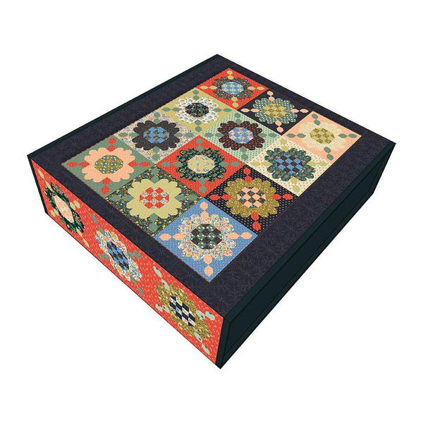 Image of the Zinnia Seeds Quilt Boxed Kit by Danelys Sidron for Riley Blake Designs. Features flowers on squares on the quilt. 
Cute Little Fabric Shop