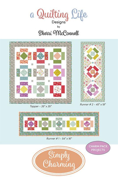 Image of the Simply Charming quilt pattern by A Quilting Life for Moda Fabrics. Features three patterns, a topper and two runners, with squares. 
Cute Little Fabric Shop