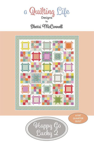 Image of the Happy Go Lucky 2 quilt pattern by A Quilting Life for Moda Fabrics. Features a quilt with many different patterned blocks.
Cute Little Fabric Shop