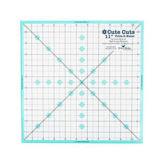 Image of the Cute Cuts™ Trim-it™ Ruler 11 inch; x 11 inch; by Lori Holt for Riley Blake Designs. Features a 11 inch square ruler with aqua borders. 
Cute Little Fabric Shop