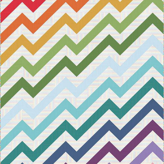 Image of the Kenzie Quilt Pattern by Purple Daisy Quilt Designs for Riley Blake Designs. Features half square triangles that create a rainbow of elongated chevron stripes. 
Cute Little Fabric Shop