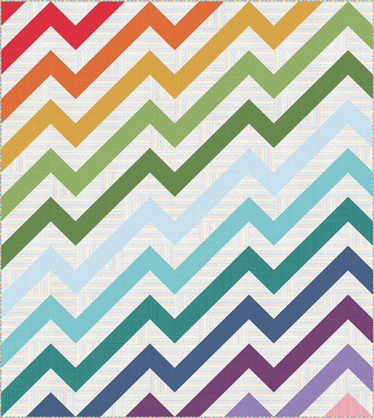Image of the Kenzie Quilt Pattern by Purple Daisy Quilt Designs for Riley Blake Designs. Features half square triangles that create a rainbow of elongated chevron stripes. 
Cute Little Fabric Shop