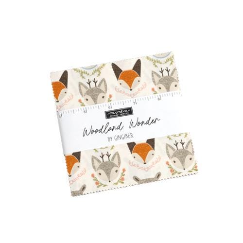 Image of the Woodland Wonder layer cake by Moda Fabrics. Features animals and flowers on various backgrounds. 
Cute Little Fabric Shop