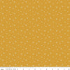 Image of the It Takes a Village Shining Star Honey quilting cotton fabric by Jennifer Long for Riley Blake Designs. Features small scattered stars on a darker yellow background. 
Cute Little Fabric Shop