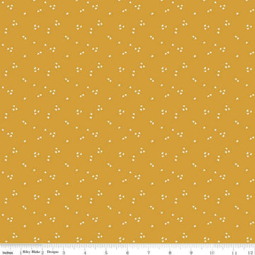 Image of the It Takes a Village Shining Star Honey quilting cotton fabric by Jennifer Long for Riley Blake Designs. Features small scattered stars on a darker yellow background. 
Cute Little Fabric Shop