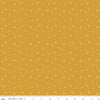 Image of the It Takes a Village Shining Star Honey quilting cotton fabric by Jennifer Long for Riley Blake Designs. Features small scattered stars on a darker yellow background. 
Cute Little Fabric Shop