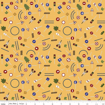 Image of the It Takes a Village Traffic Signs Sunshine quilting cotton fabric by Jennifer Long for Riley Blake Designs. Features street signs, trees, train tracks, and more on a yellow background. 
Cute Little Fabric Shop