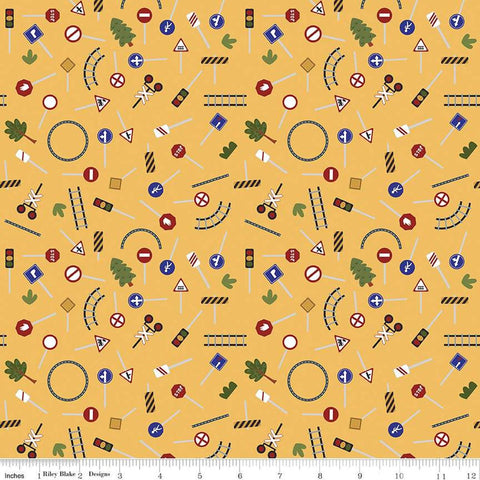 Image of the It Takes a Village Traffic Signs Sunshine quilting cotton fabric by Jennifer Long for Riley Blake Designs. Features street signs, trees, train tracks, and more on a yellow background. 
Cute Little Fabric Shop