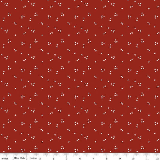 Image of the It Takes a Village Shining Star Fire Truck Red quilting cotton fabric by Jennifer Long for Riley Blake Designs. Features small scattered star on a bright red background. 
Cute Little Fabric Shop