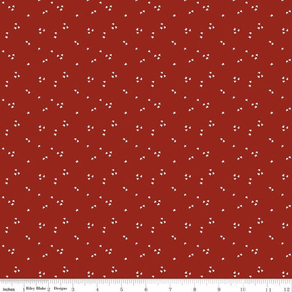 Image of the It Takes a Village Shining Star Fire Truck Red quilting cotton fabric by Jennifer Long for Riley Blake Designs. Features small scattered star on a bright red background. 
Cute Little Fabric Shop