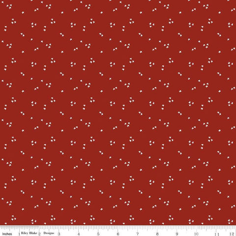 Image of the It Takes a Village Shining Star Fire Truck Red quilting cotton fabric by Jennifer Long for Riley Blake Designs. Features small scattered star on a bright red background. 
Cute Little Fabric Shop