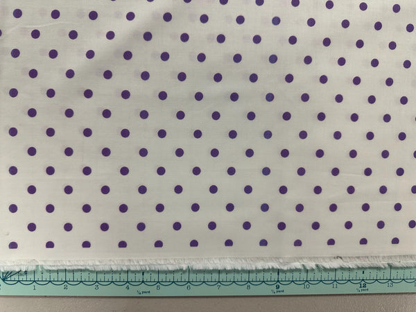 a piece of cloth with purple dots on it