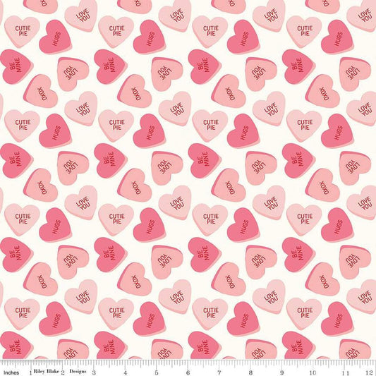 Image of the Sweetheart Main Cream quilting cotton fabric by My Minds Eye for Riley Blake Designs. Features conversation hearts on a cream background.
Cute Little Fabric Shop