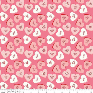 Image of the Sweetheart Main Hot Pink quilting cotton fabric by My Minds Eye for Riley Blake Designs. Features conversation hearts on a pink background.
Cute Little Fabric Shop