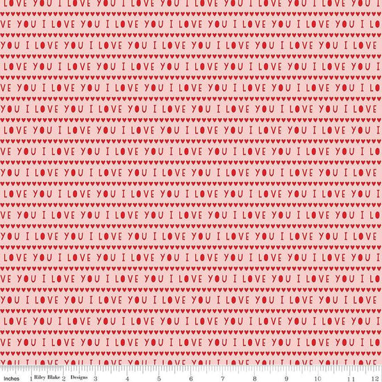 Image of the Sweetheart I Love You Pink quilting cotton fabric by My Minds Eye for Riley Blake Designs. Features striped I Love You words on a light pink background.
Cute Little Fabric Shop