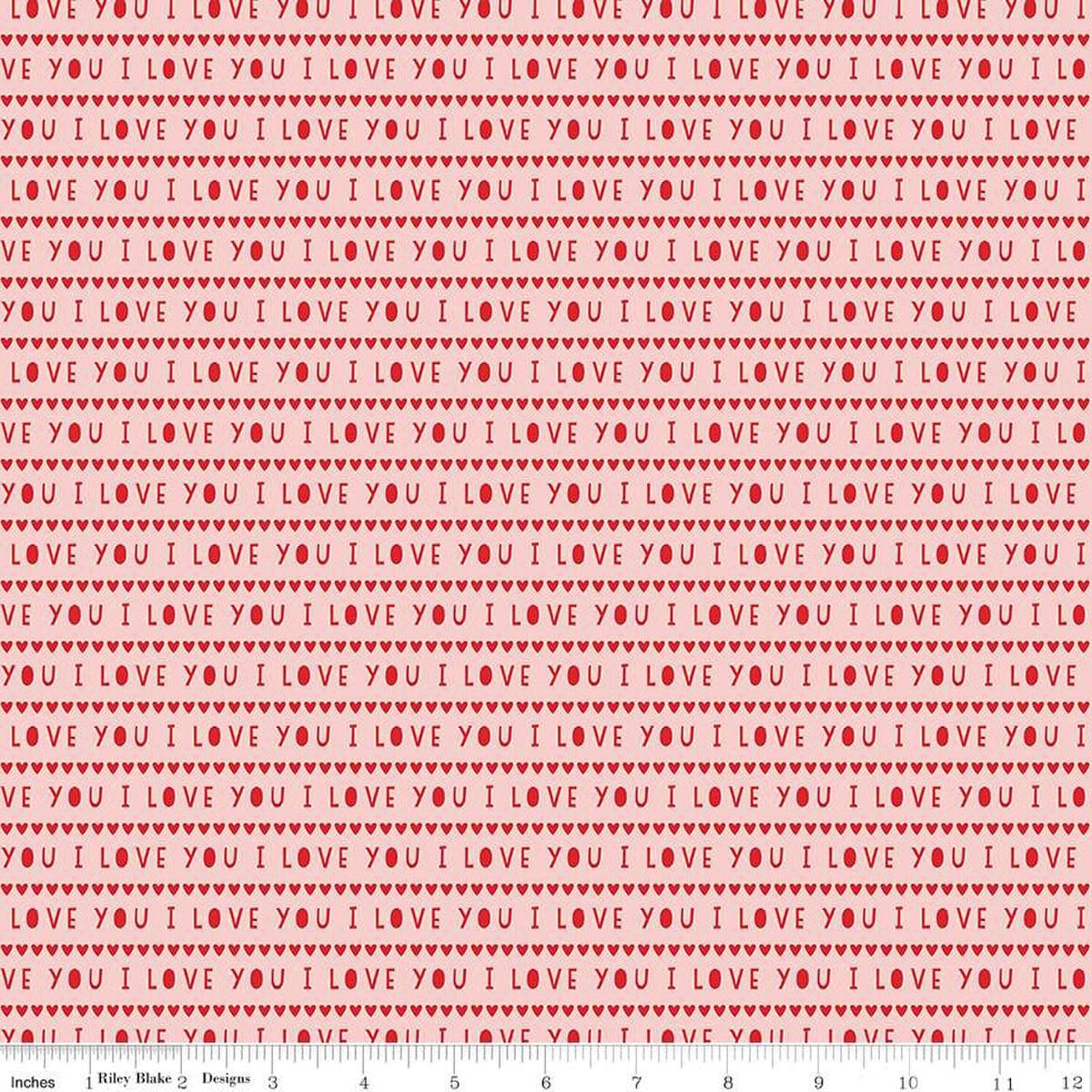 Image of the Sweetheart I Love You Pink quilting cotton fabric by My Minds Eye for Riley Blake Designs. Features striped I Love You words on a light pink background.
Cute Little Fabric Shop