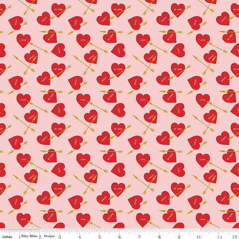 Image of the Sweetheart Heart Arrows Pink quilting cotton fabric by My Minds Eye for Riley Blake Designs. Features conversation hearts and arrows on a pink background.
Cute Little Fabric Shop