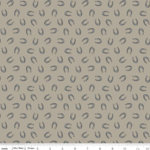 Image of the Cowboys Horseshoes Khaki quilting cotton fabric by Echo Park Paper Co for Riley Blake Designs. Features horseshoes on a brown grey background.
Cute Little Fabric Shop