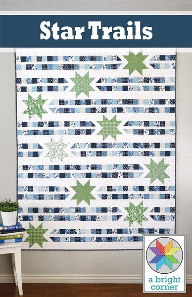 Image of the Star Trails quilt pattern by A Bright Corner for Riley Blake Designs. Features stars and stripes on a white quilt background. 
Cute Little Fabric Shop