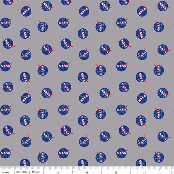 Image of the Outer Space by NASA Logo Toss Gray quilting cotton fabric by NASA for Riley Blake Designs. Features the NASA Logos on a gray background. 
Cute Little Fabric Shop