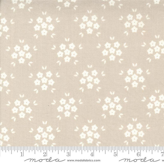Image of the Hollyhocks Roses Puffs Linen quilting cotton fabric by Moda Fabrics. Features small flowers on a tan background. 
Cute Little Fabric Shop