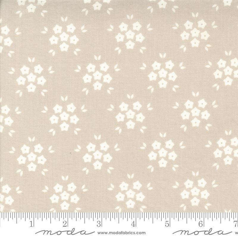 Image of the Hollyhocks Roses Puffs Linen quilting cotton fabric by Moda Fabrics. Features small flowers on a tan background. 
Cute Little Fabric Shop