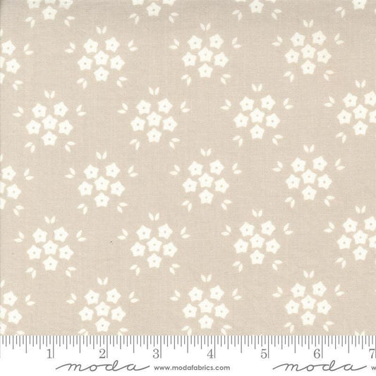 Image of the Hollyhocks Roses Puffs Linen quilting cotton fabric by Moda Fabrics. Features small flowers on a tan background. 
Cute Little Fabric Shop