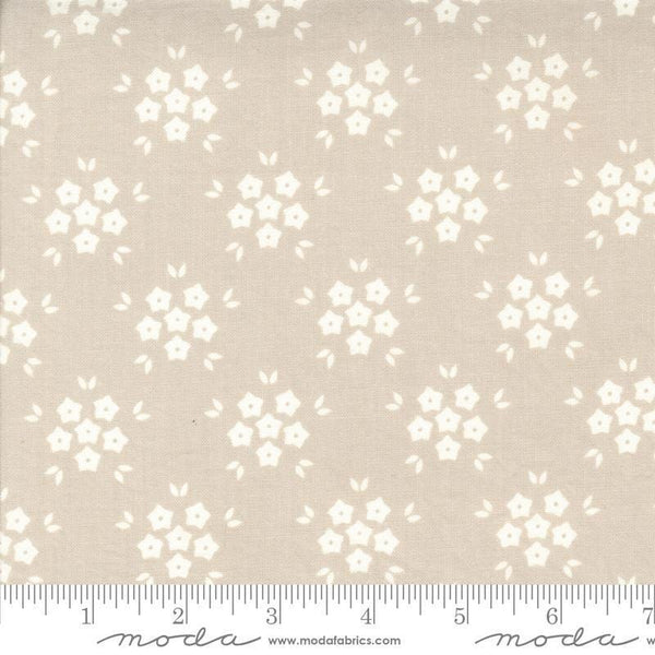 Image of the Hollyhocks Roses Puffs Linen quilting cotton fabric by Moda Fabrics. Features small flowers on a tan background. 
Cute Little Fabric Shop