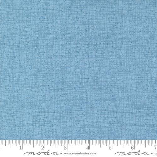 Thatched Breeze quilting cotton fabric by Gingiber for Moda Fabrics. Features a textured and lined pattern on a light blue background. 
Cute Little Fabric Shop