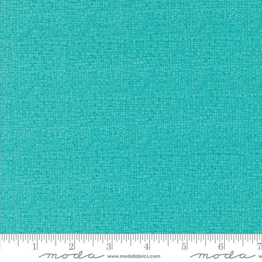 Thatched Surf quilting cotton fabric by Gingiber for Moda Fabrics. Features a textured and lined pattern on a bright aqua background. 
Cute Little Fabric Shop