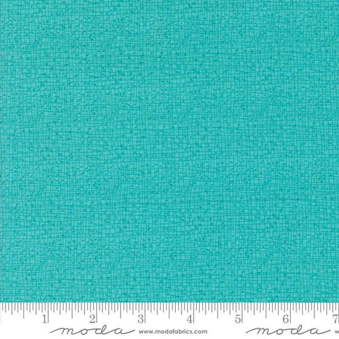 Thatched Surf quilting cotton fabric by Gingiber for Moda Fabrics. Features a textured and lined pattern on a bright aqua background. 
Cute Little Fabric Shop