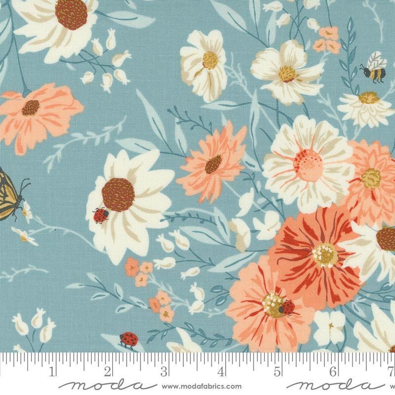 Image of the Farmstead  Main Mountain Stream quilting cotton fabric by Stacy Iest Hsu for Moda Fabrics. Features large flowers and blossoms on a blue background. 
Cute Little Fabric Shop