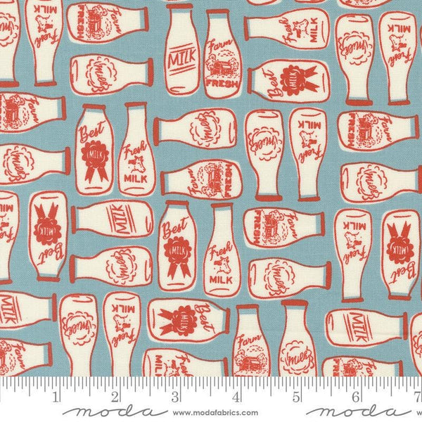 Image of the Farmstead Milk Mountain Stream quilting cotton fabric by Stacy Iest Hsu for Moda Fabrics. Features bottles of milk on a dusty blue background. 
Cute Little Fabric Shop