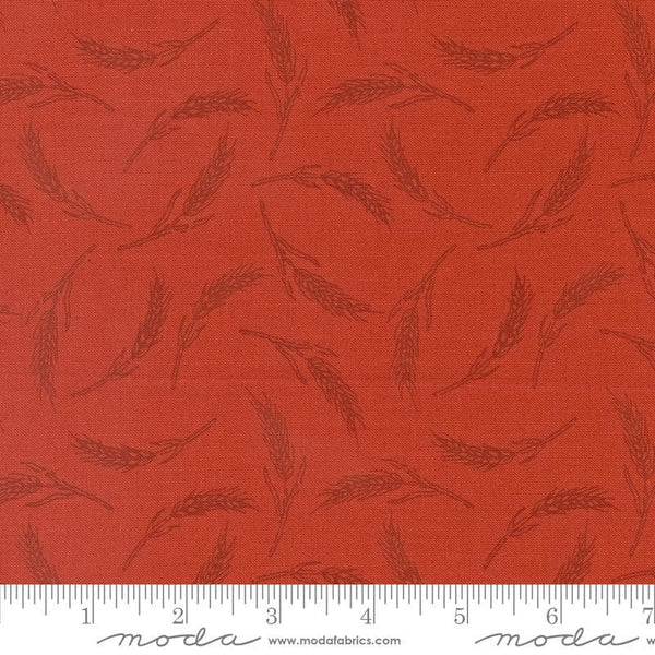 Image of the Farmstead Wheat Copper quilting cotton fabric by Stacy Iest Hsu for Moda Fabrics. Features small pieces of wheat on a red background. 
Cute Little Fabric Shop