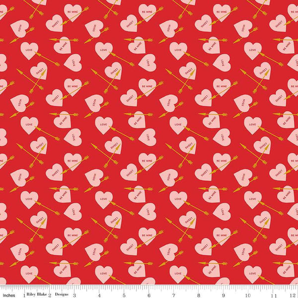 Image of the Sweetheart Heart Arrows Red quilting cotton fabric by My Minds Eye for Riley Blake Designs. Features conversation hearts and arrows on a red background.
Cute Little Fabric Shop